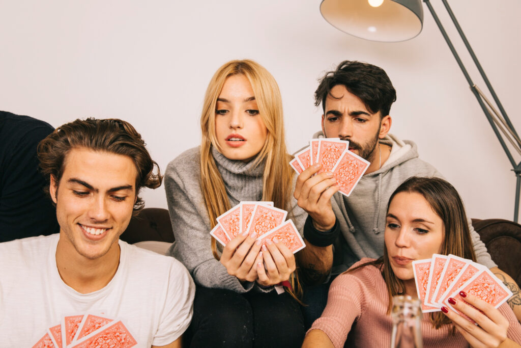 students play card game