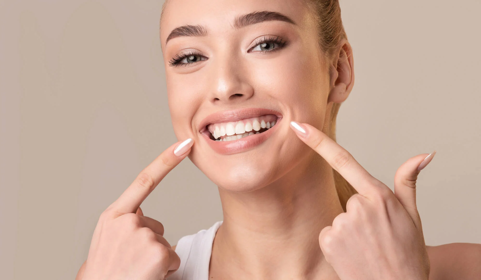 happy after getting professional teeth whitening from the Best Cosmetic in Dentist Boca Raton