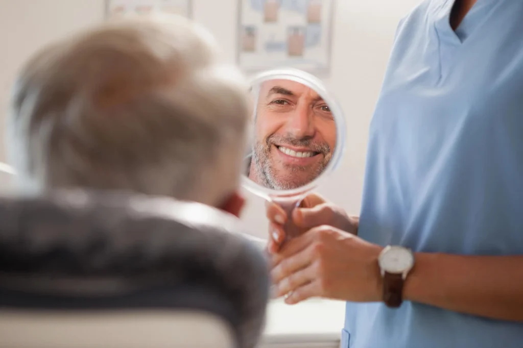 a-patient-loving-his-new-Dental-Crowns-in-Boca-Raton 