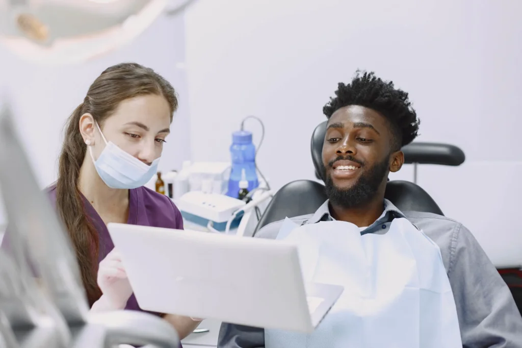 dentist discussing Wisdom Teeth Removal in Boca Raton