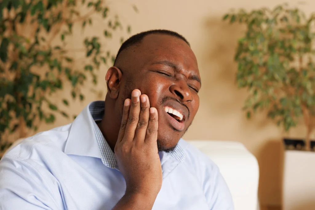 man with impacted wisdom tooth needing Wisdom Teeth Removal in Boca Raton