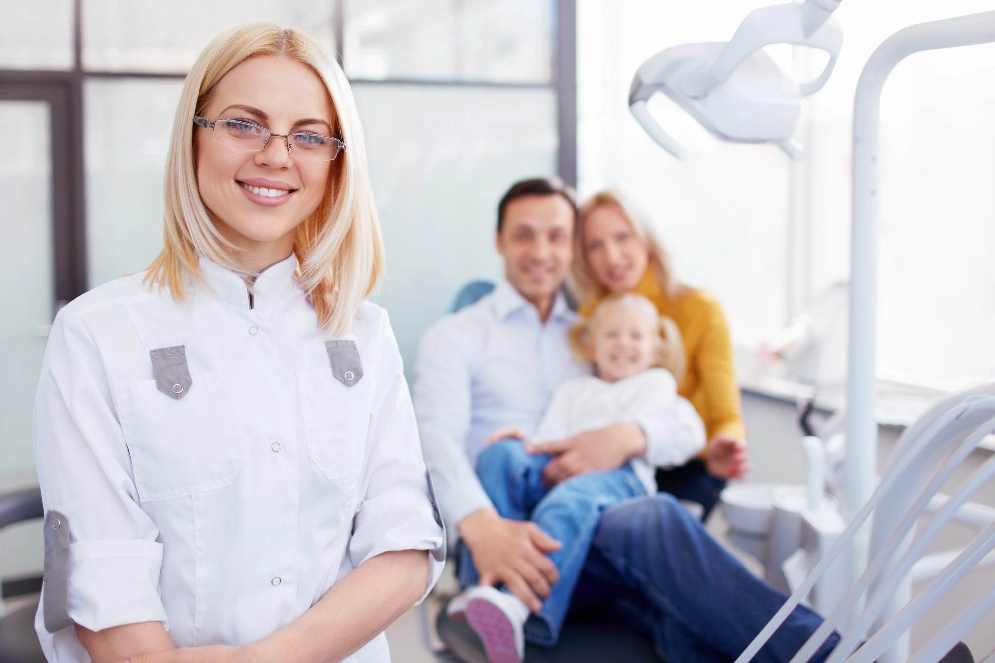 A trusted dentist in west boca smiing with the patients