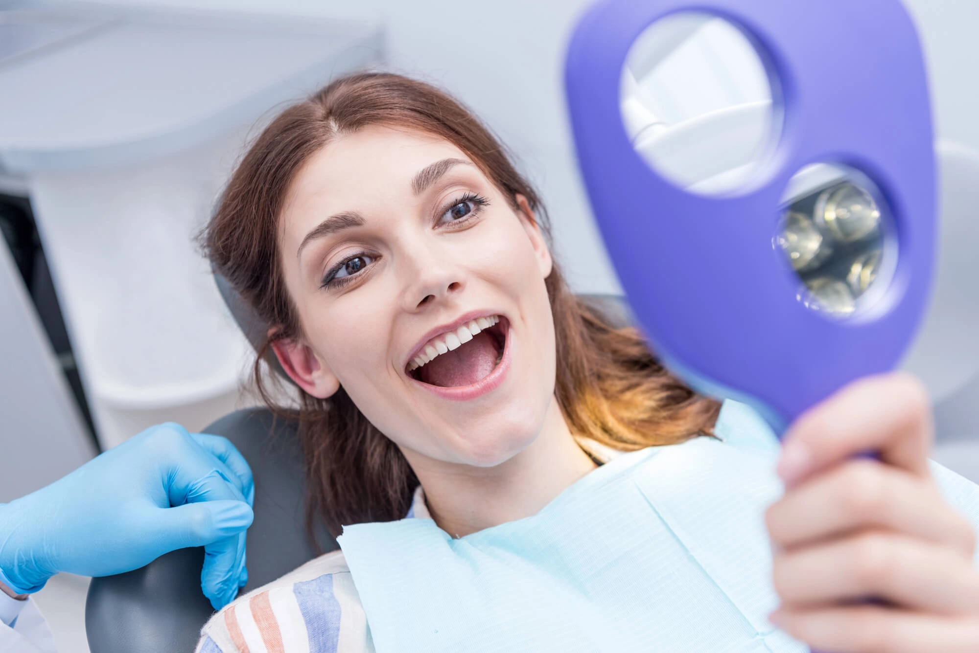 Woman-happy-with-her-all-on-4-dentures-boca-raton