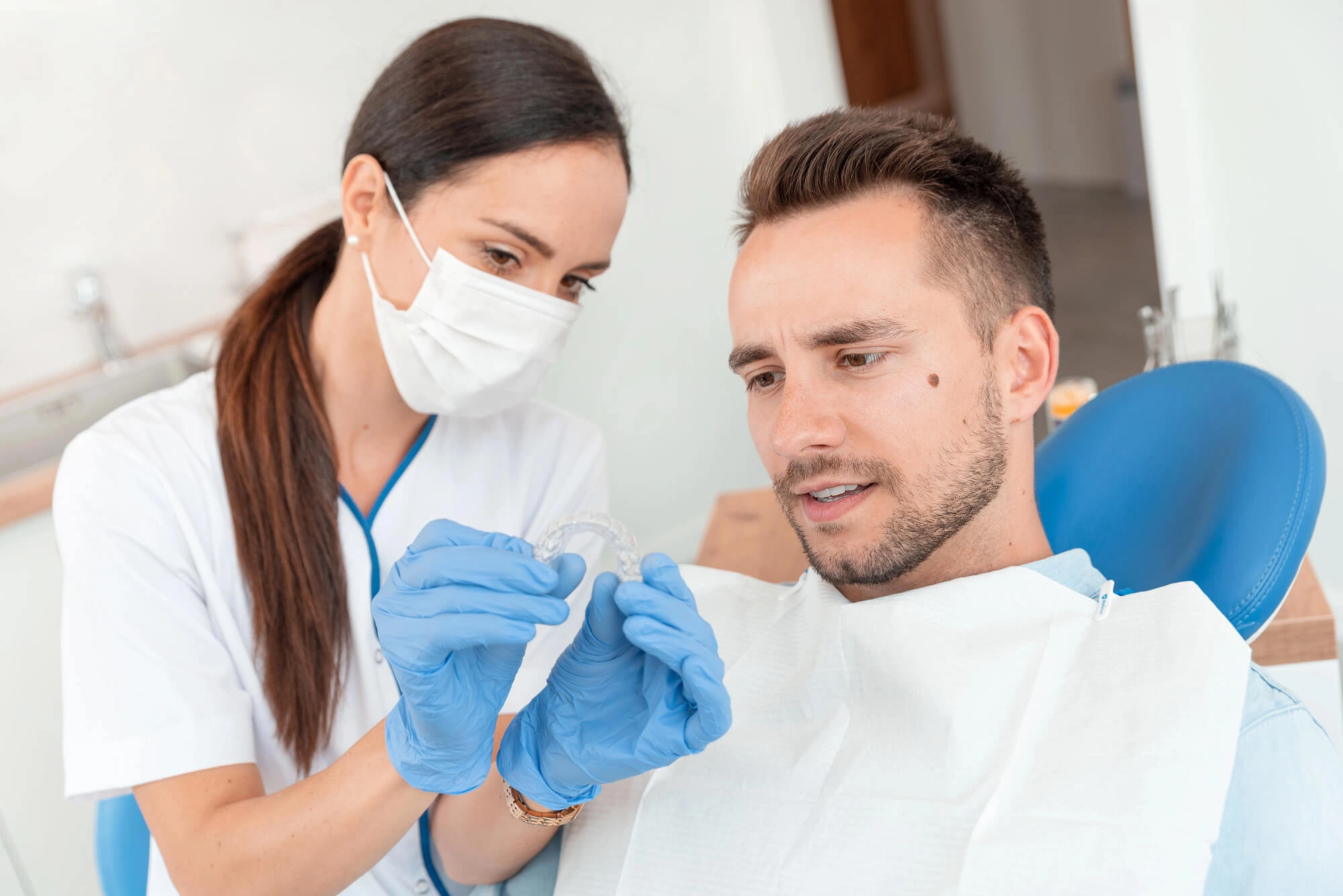 orthodontist boca raton instructing patient