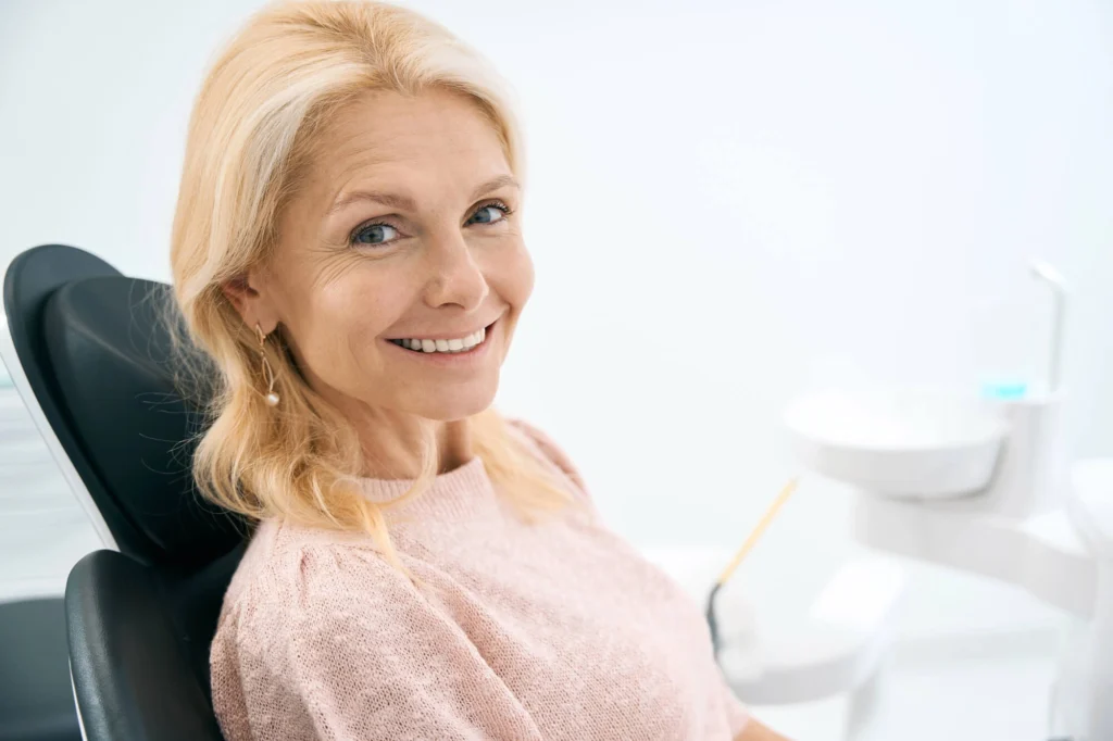 Woman smiling with dental crowns boca raton