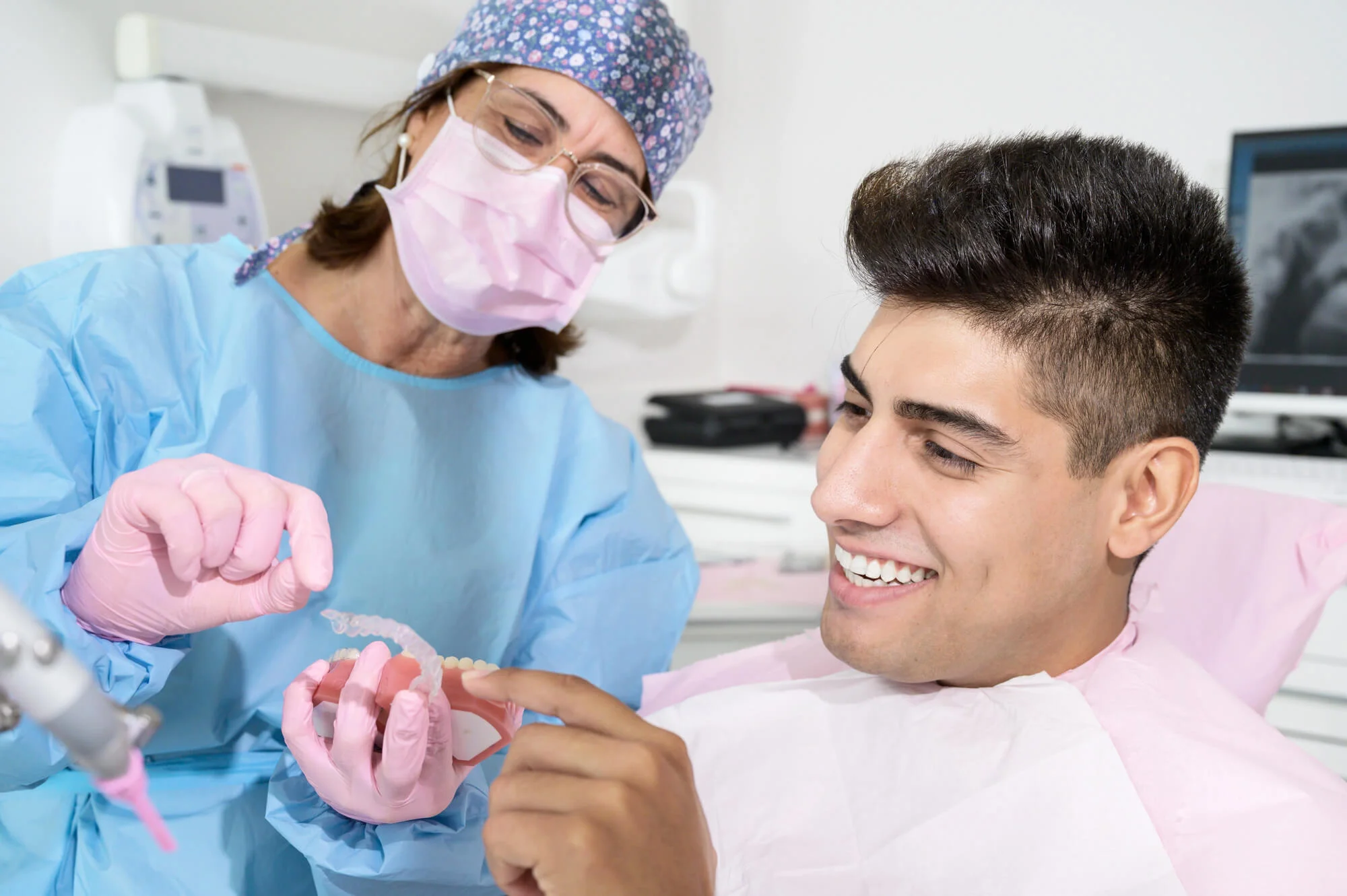 Man looking at his invisalign boca raton
